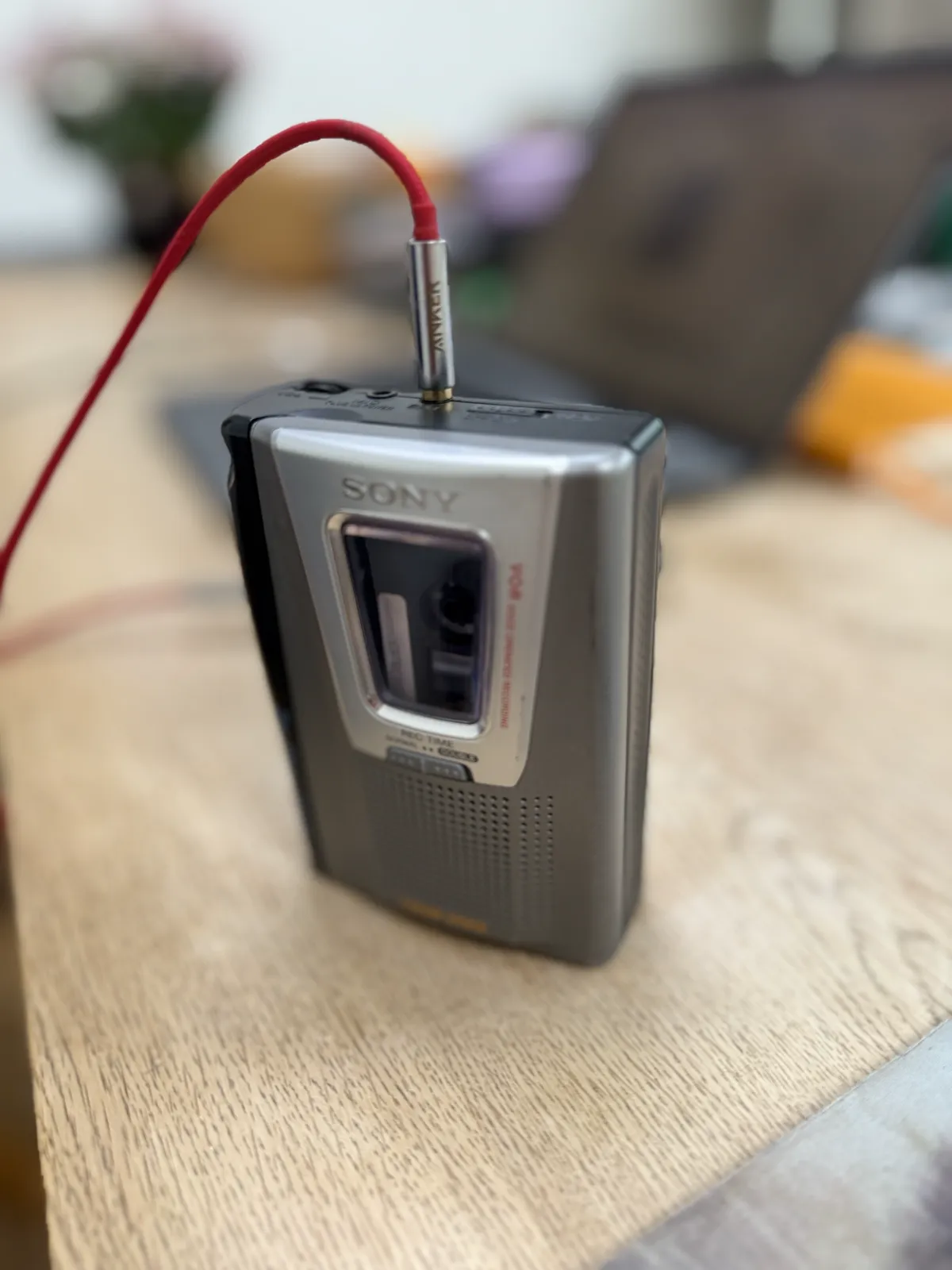 The cassette player wired up via the headphone socket